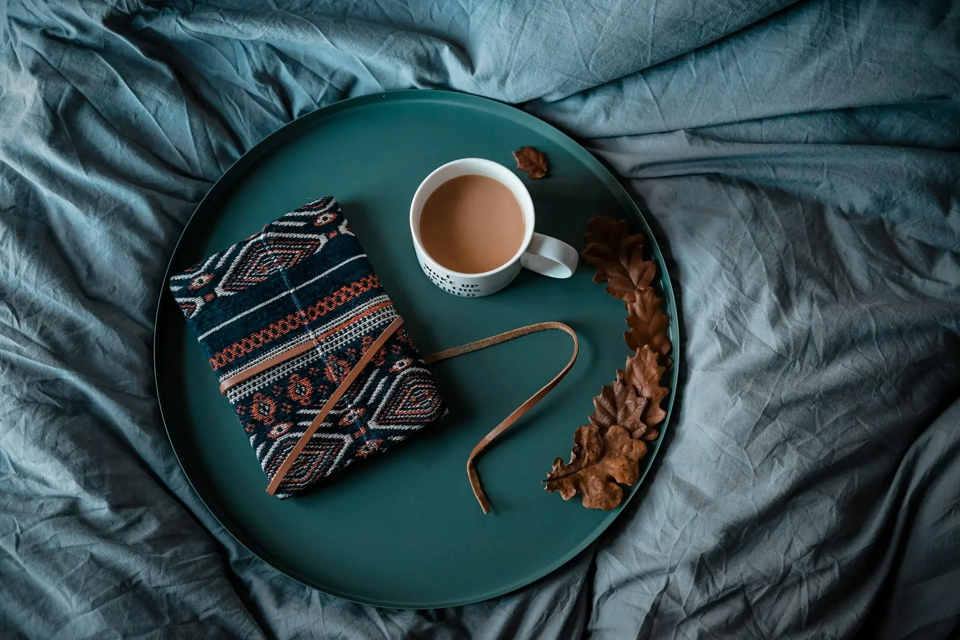 white ceramic mug on round green tray